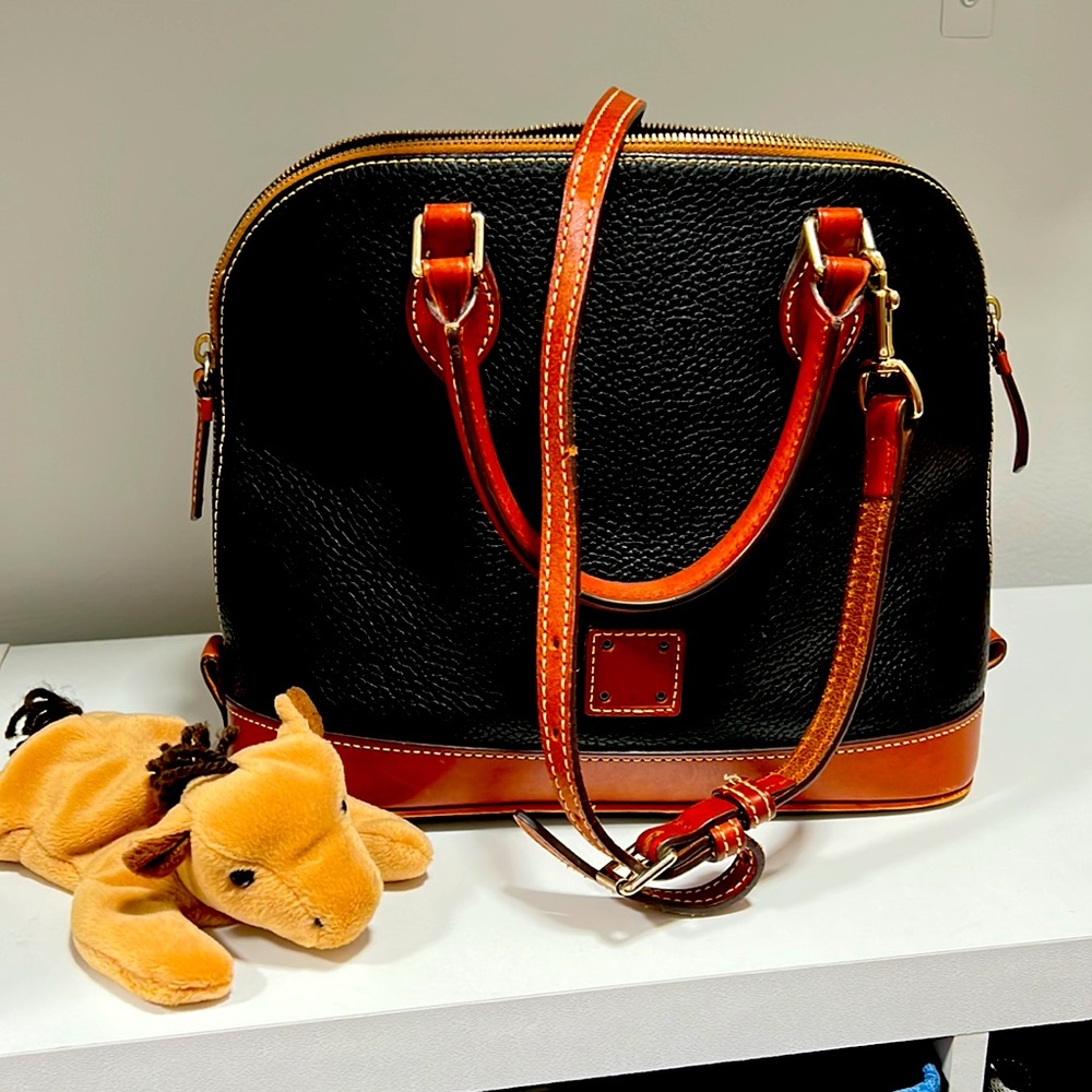 Dooney and Bourke  black/tan leather purse with cross body strap